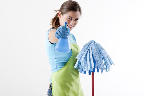 Cleaner preparing a Bermondsey flat for end of tenancy inspection
